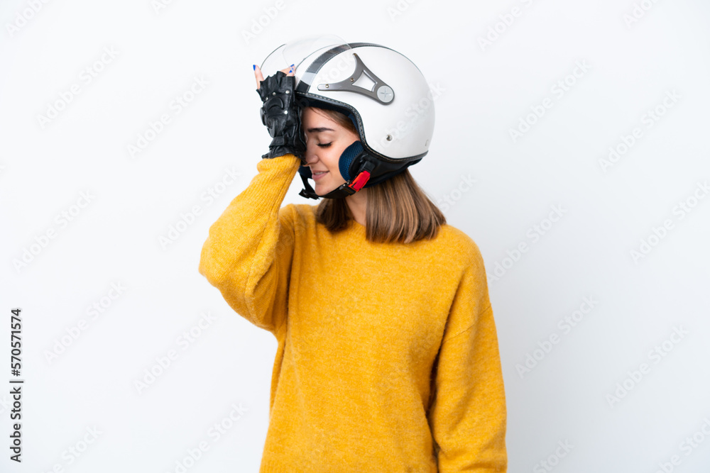 Young caucasian woman with a motorcycle helmet isolated on white background has realized something and intending the solution Young caucasian woman with a motorcycle helmet isolated on white background has realized something and intending the solution