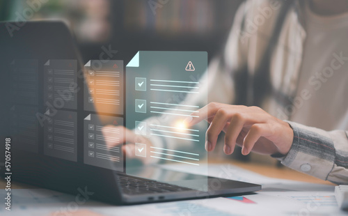 Businessman checking the steps through a virtual online document with a list of checkboxes Concepts of practices and policies, company articles of association Terms and Conditions, Finding errors.