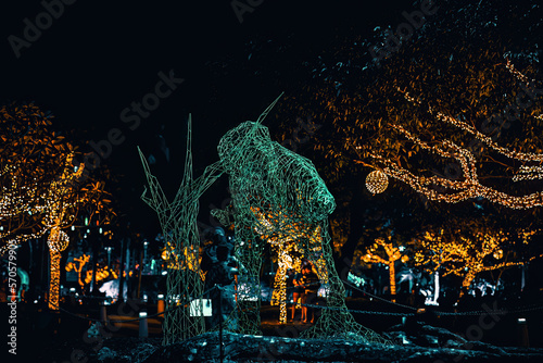 Led lights on the trees in the garden. Neon fairy party.