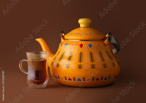 Arabic Traditional Hospitality (Saudi Arabia). Bedouin lifestyle, Iconic Abrian fabric is graced with sybbols of Arabia, in particular Arabic tea and dates, they symbolise Arabian hospitality. photo