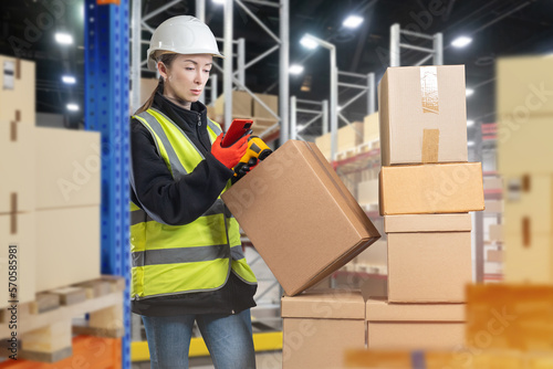 Woman works in warehouse. G...