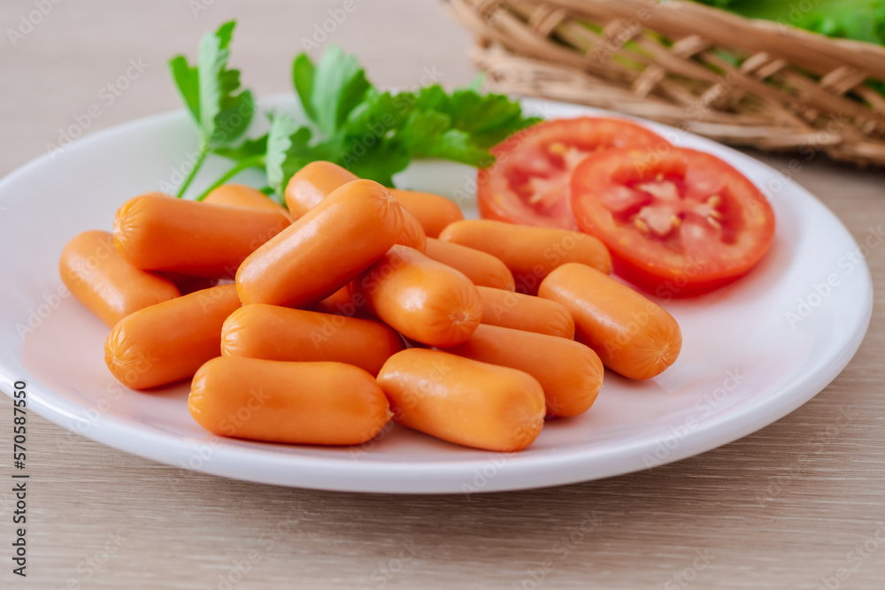 Mini sausage and vegetable on white plate. Mini sausage and vegetable on white plate.