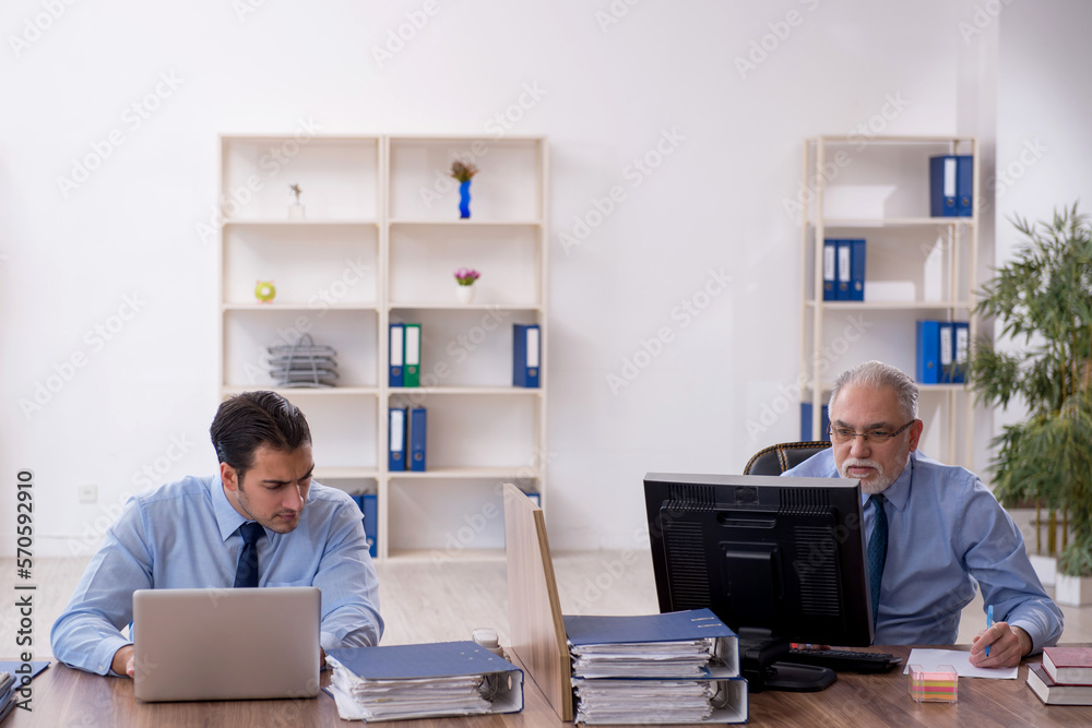 Two male colleagues working in the office Two male colleagues working in the office