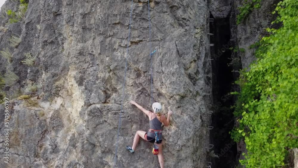 Climbing while having a helping hand from the rope Climbing while having a helping hand from the rope