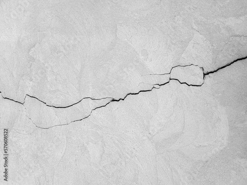 Photography A long horizontal crack on a gray plastered surface