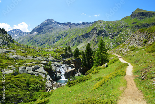 Gran Paradiso National Park. Hiking trail in the Valle di Bardoney, Aosta Valley, Italy. Beautiful mountain landscape in sunny day.