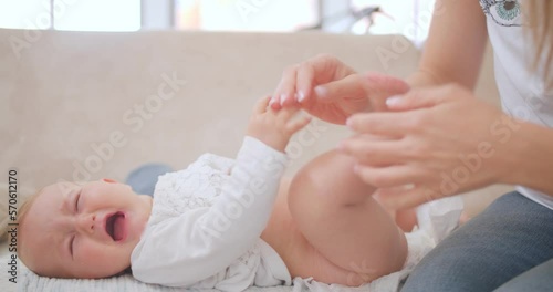 Mother changing diaper