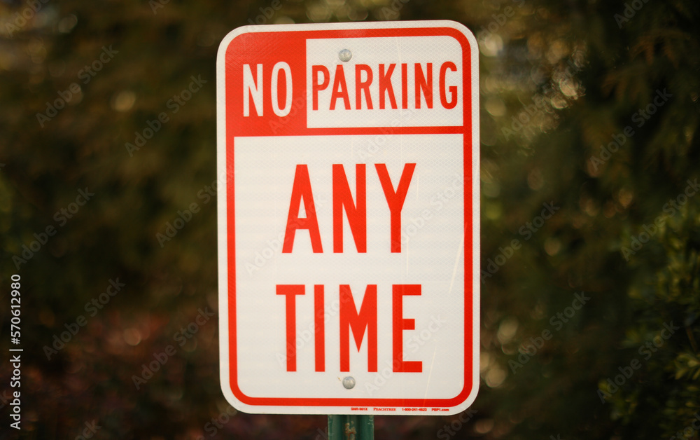 Parking sign during daytime road information Parking sign during daytime road information