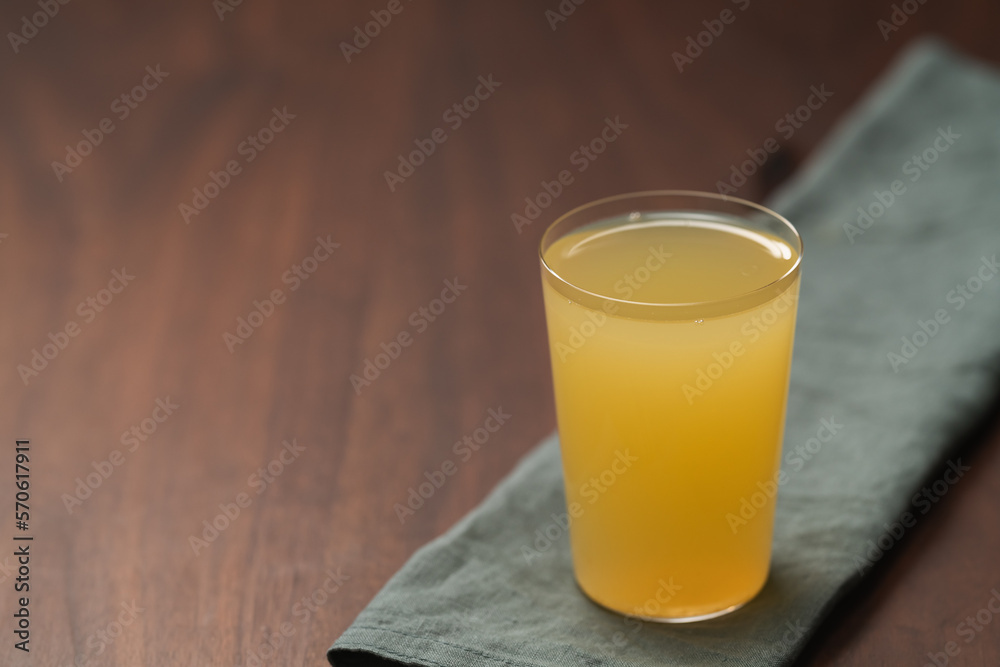 Lemonade in tumbler glass on linen napkin with copy space Lemonade in tumbler glass on linen napkin with copy space