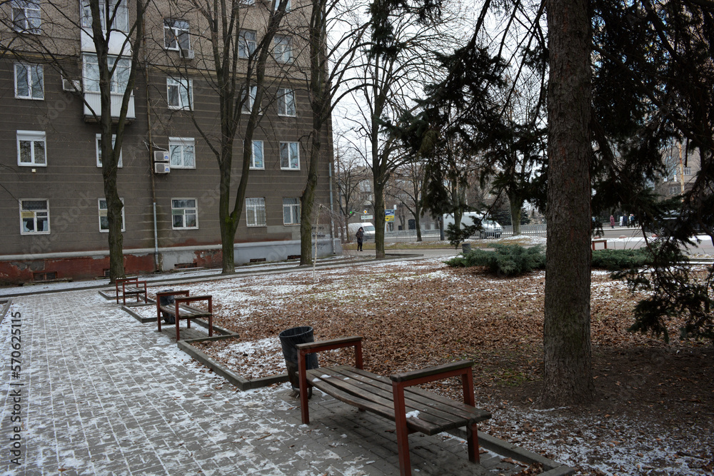 Winter photos of the big street Rabochaya in the city of Dnipro, ukraine. Wide road, parks, yards with cars, people, trees, Christmas trees, big houses and shops on a weekday. Winter photos of the big street Rabochaya in the city of Dnipro, ukraine. Wide road, parks, yards with cars, people, trees, Christmas trees, big houses and shops on a weekday.