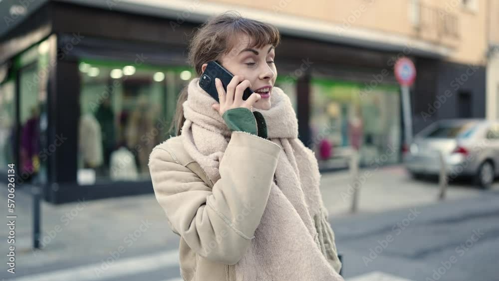Young caucasian woman talking on the phone at street Young caucasian woman talking on the phone at street