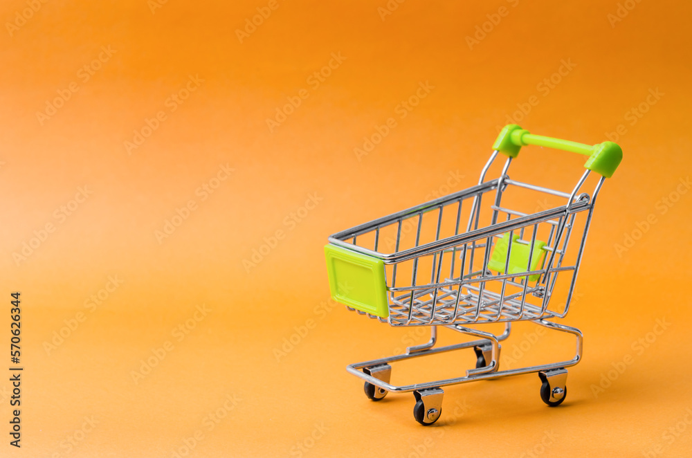 Empty Shopping Cart on a isolated yellow background.