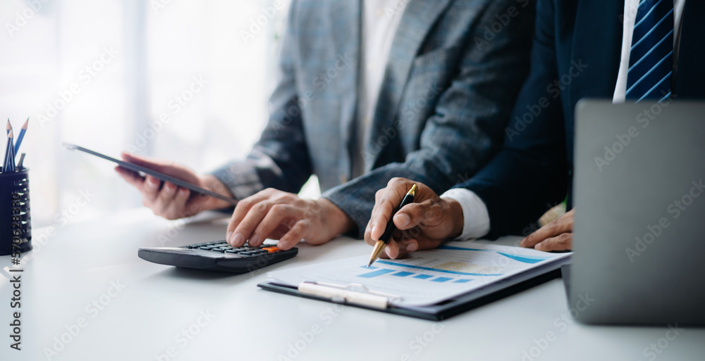 Businessman and team analyzing financial statement Finance task. with smart phone and laptop and tablet. Businessman and team analyzing financial statement Finance task. with smart phone and laptop and tablet.