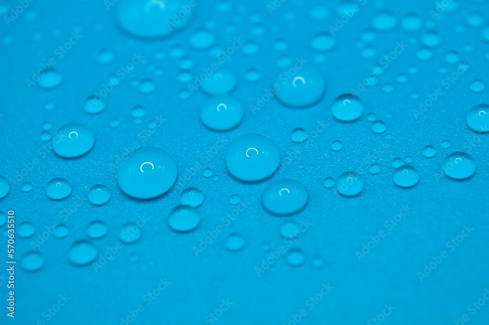 macro drops of water on a blue background