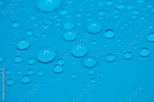 macro drops of water on a blue background