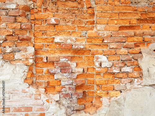 Damaged red brick wall texture background.