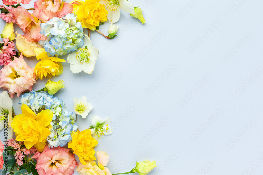Spring Flowers composition on pastel blue background. Floral concept for Easter, Woman's day or Valentine's day.