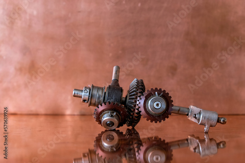 Mechanical device. Bevel gear. The differential.  Copper background.