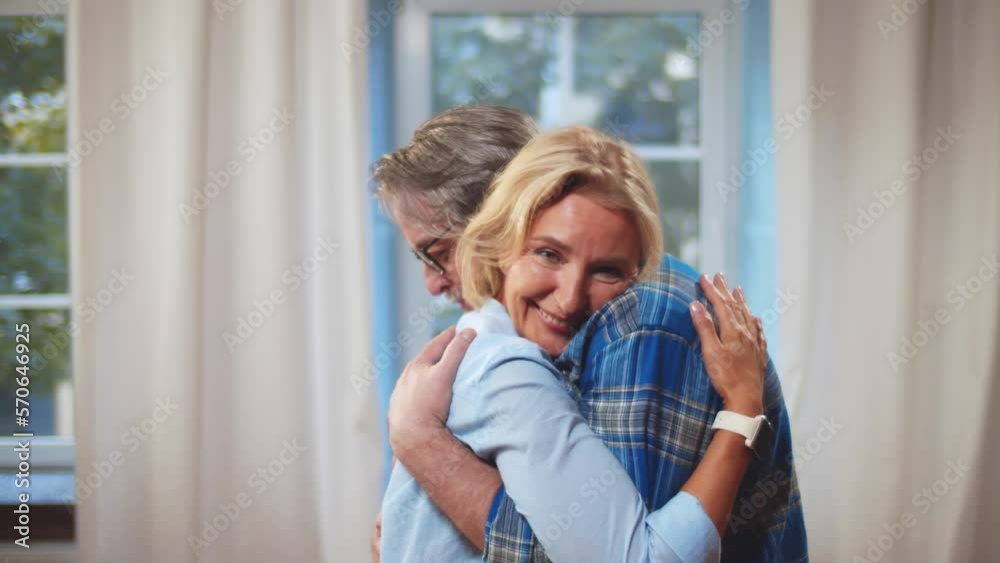 Mature happy couple hugging and smiling at home. Realtime Mature happy couple hugging and smiling at home. Realtime