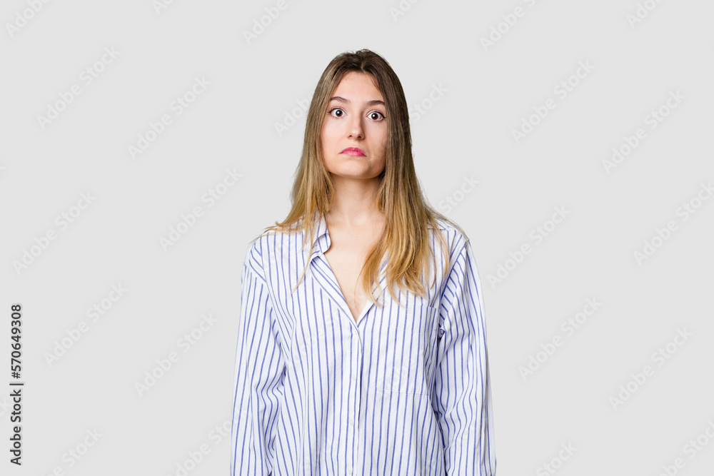Young blonde posing for a portrait isolated, exuding natural beauty and radiance sad, serious face, feeling miserable and displeased. Young blonde posing for a portrait isolated, exuding natural beauty and radiance sad, serious face, feeling miserable and displeased.