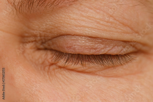 Foto close up part face mature woman 55 years old, closed human eye, lower, upper eye