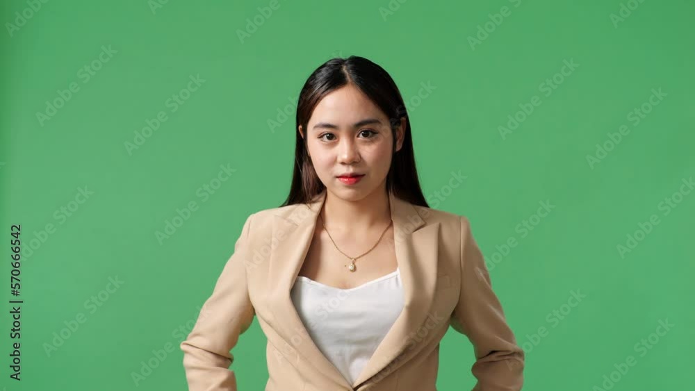 An Asian Business Woman Warmly Smiling On Green Screen Background In The Studio
An Asian Business Woman Warmly Smiling On Green Screen Background In The Studio