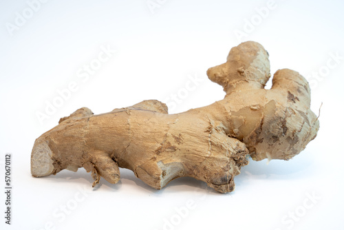 Root ginger isolated on a white studio background. Ingredient for healthy cooking and lifestyle.