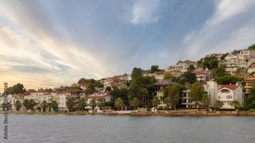 View of the hills of Kinaliada island from Marmara Sea, with traditional summer houses at dawn, Istanbul, Turkey