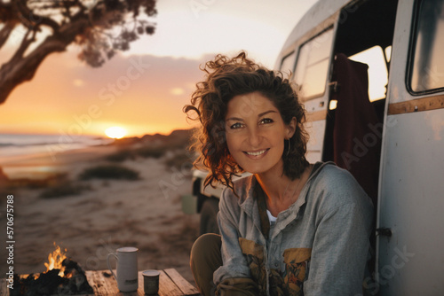 woman sitting in her camper van beside the ocean in sunset, generative ai