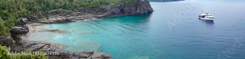 A panoramic view of the crystal clear blue waters at The Grotto in Bruce Peninsula National Park near Tobermory, Ontario.