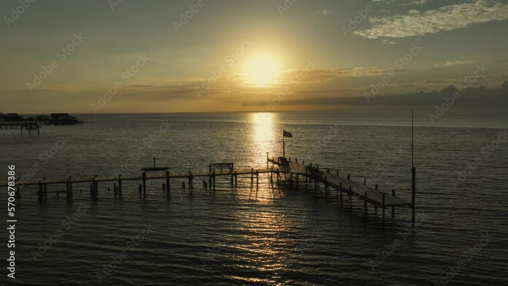 Sunset over Mobile Bay near the American Legion in Fairhope, Alabama Sunset over Mobile Bay near the American Legion in Fairhope, Alabama