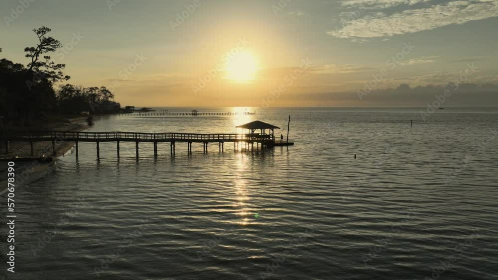 Sunset over Mobile Bay near the American Legion dock in Alabama Sunset over Mobile Bay near the American Legion dock in Alabama