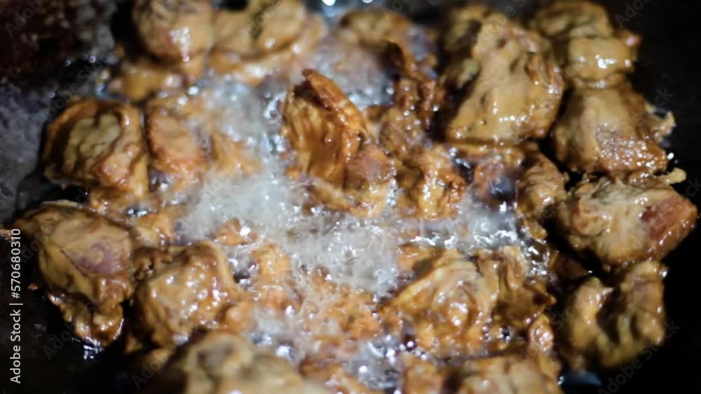 Close-up shot of chicken pieces frying in hot oil, Hd footage. Fried Chicken. Frying Chicken in oil. Close-up shot of chicken pieces frying in hot oil, Hd footage. Fried Chicken. Frying Chicken in oil.