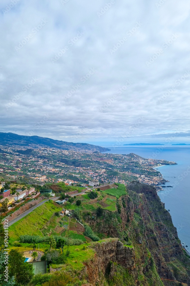 A picturesque view from a height of the green coast of madeira Island.