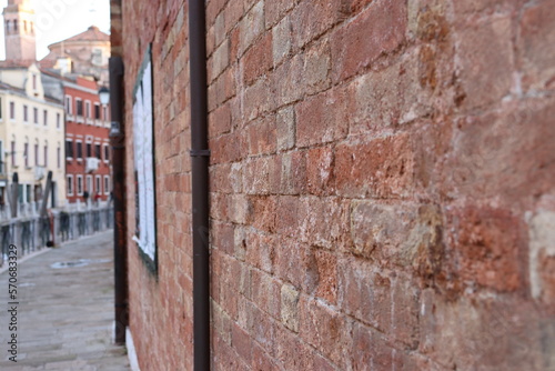 View of the Fondamenta Tolentino street in Venice, Italy. Street scene, old wall.