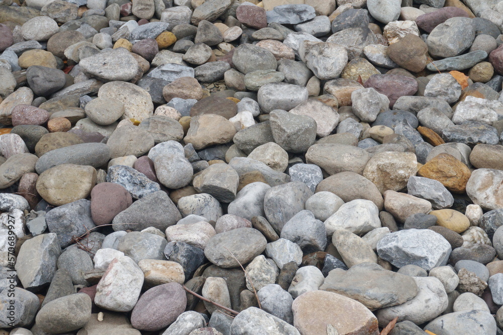 Gray, Tan and Brick Colored Stones as Background Gray, Tan and Brick Colored Stones as Background