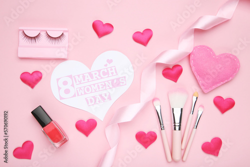 Card in shape of heart with text 8 March Women's Day, hearts and ribbon, nail polish, set makeup brushes and eyelashes on pink background