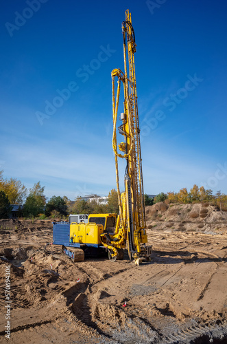 Pile driver on a construction site. A pile machine for deep foundation installation.