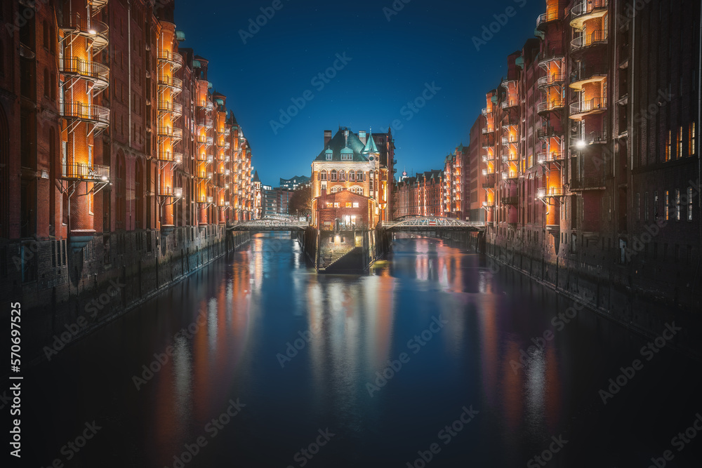 Famous view of Speicherstadt warehouse district with Wasserschloss Building at night - Hamburg, Germany