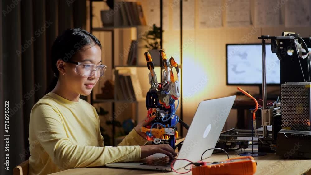 Teen Asian Girl Checking And Comparing A Cyborg Hand To The Picture On A Laptop At Home While At Home
Teen Asian Girl Checking And Comparing A Cyborg Hand To The Picture On A Laptop At Home While At Home