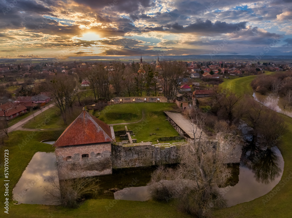 Aerial view of Onod castle medieval four tower ruin near the Sajo river in Borsod county Hungary with stunning sunset sky