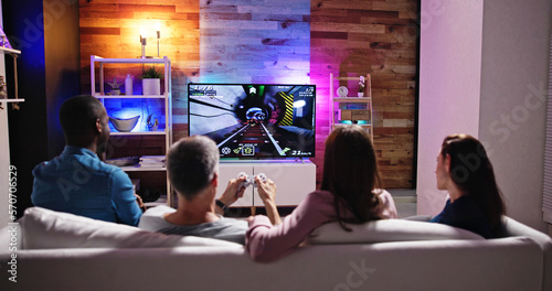 Rear View Of An People Playing Video Games