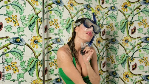 Woman dancing in shower with snorkel