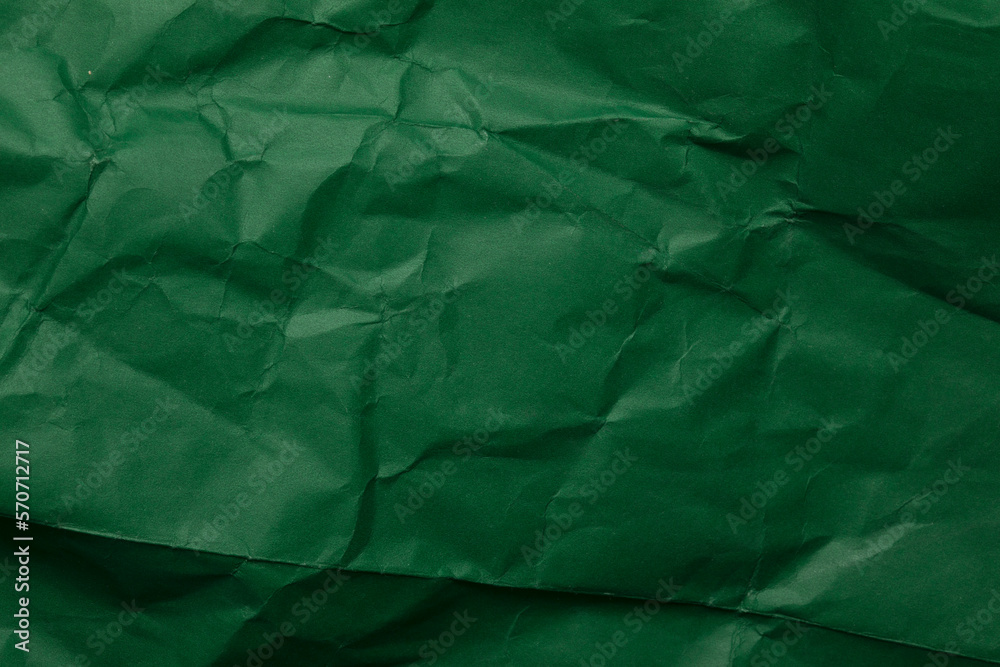 Green crumpled paper texture background Green crumpled paper texture background