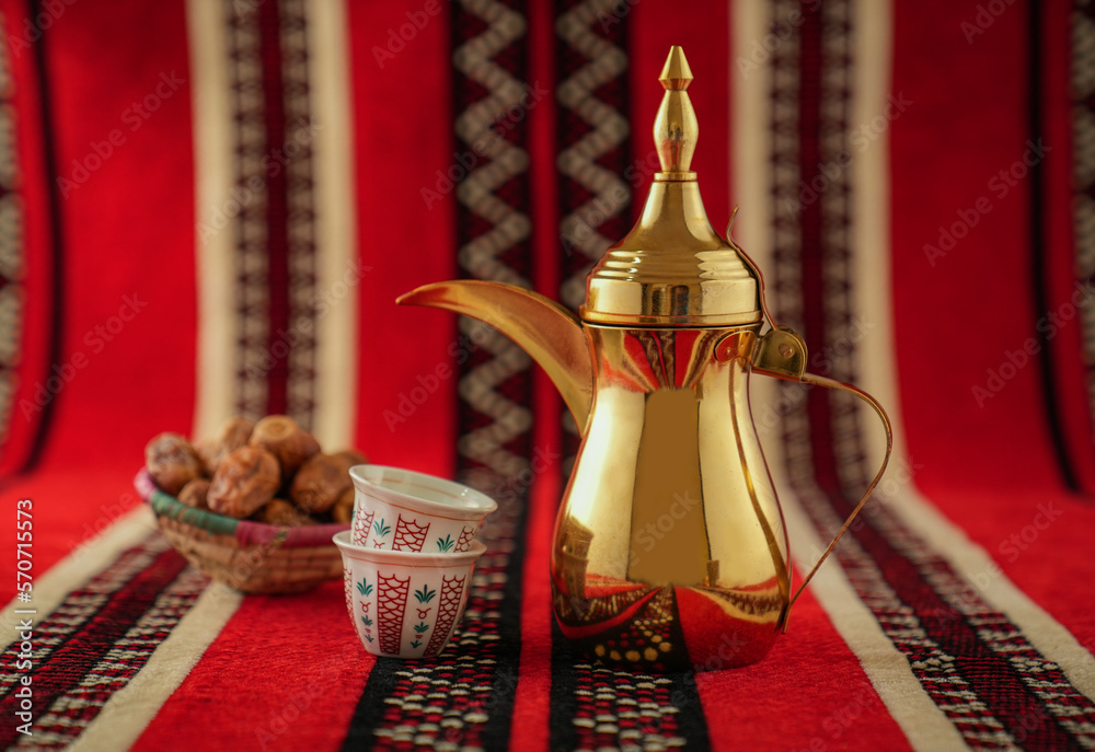 dallah is a metal pot with a long spout designed specifically for making  Arabic coffee, Saudi coffee, arabic coffee and dates. Stock Photo | Adobe  Stock