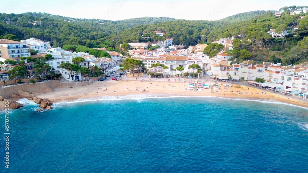 aerial view of the beautiful spanish town of Tamariu in a bay on the Mediterranean Sea with a promenade and a beach, Catalonia, Costa Brava, Girona
