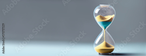 an hourglass on grey background Dead line Banner Space for text on the left