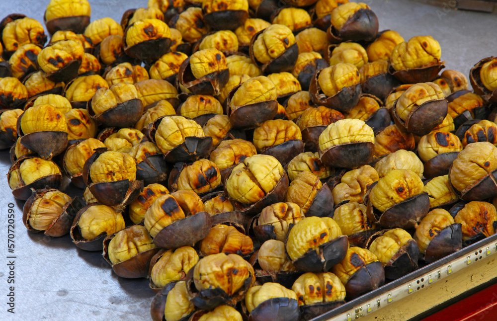 Roasting chestnuts on the grill by a street vendor in Istanbul, Turkey