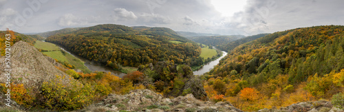 Autumn day on the rocks above the Berounka river valley - gray clouds with the sun shining through