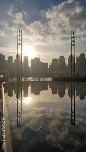 Panoramic view of Business Bay district with reflection in sea in morning. Aerial sky at highest buildings in central Dubai, United Arab Emirates © lara-sh
